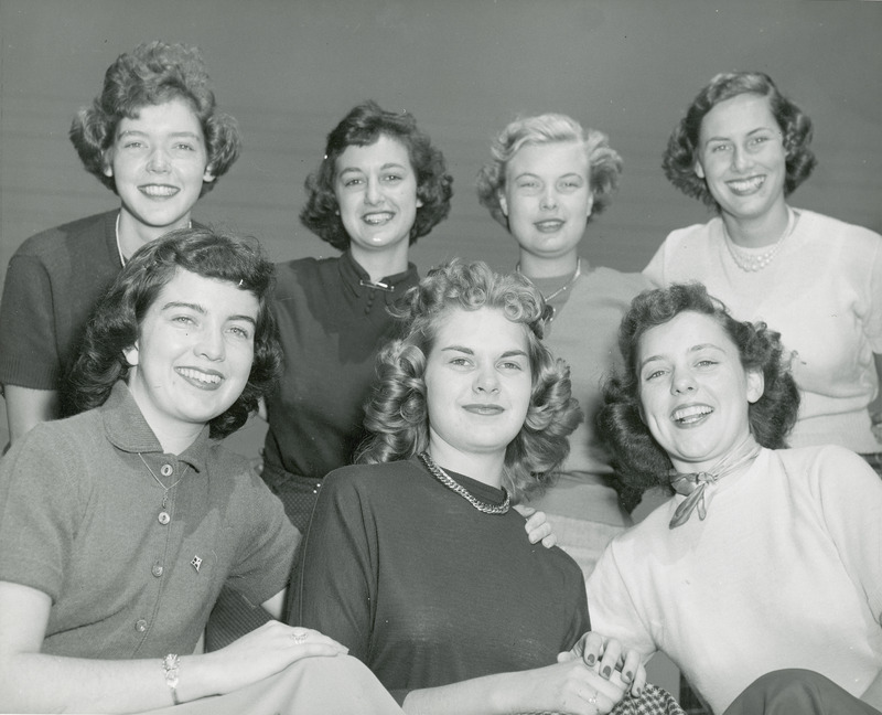 The 1950 homecoming queen candidates are front row (left to right): Rita Dunn (Queen), Sioux City; Betty Skyberg (Attendant), Canton, SD; Claire Schubert, Maywood, IL; back row (left to right): Marlene Sidney, Davenport; Janet Green, Sac City; Ethel Pearce, Mesa, AZ; Patricia Binder, Barrington, IL.