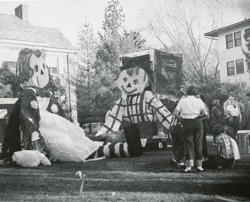 Several students are working on the Kappa Kappa Gamma, Delta Omicron Chapter Raggedy Ann and Andy lawn display.