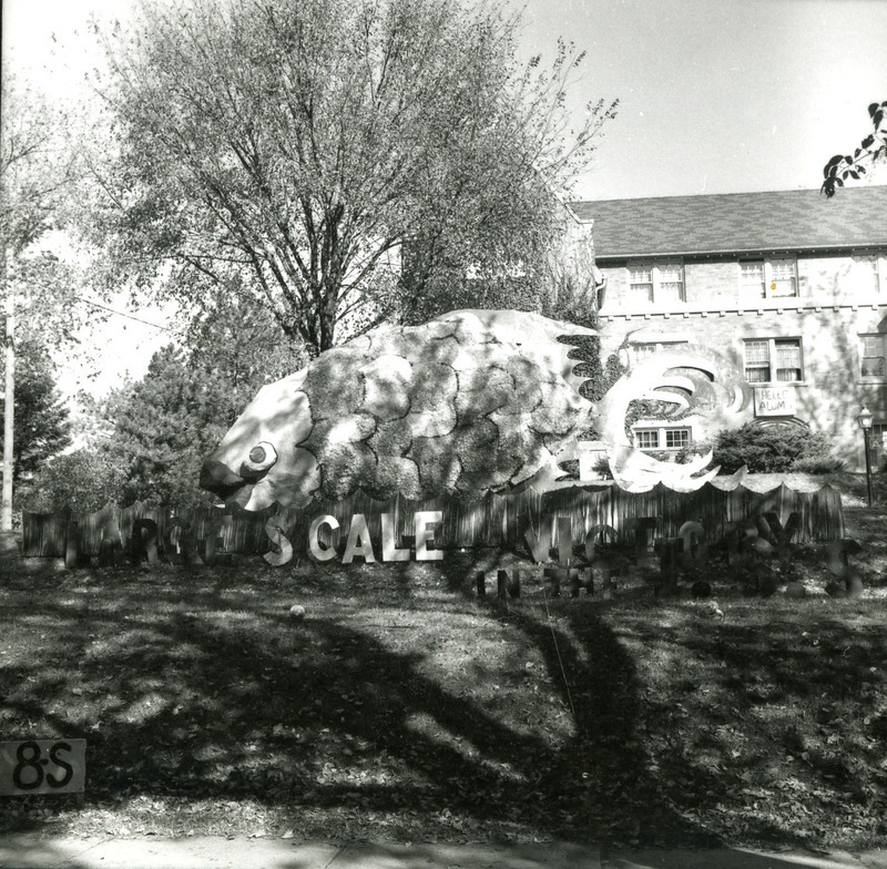 The Alpha Delta Pi's 1st place winner in the sorority division lawn display is a large Missouri fish. Below the display a sign reads "Large scale victory in the ISC sea.".