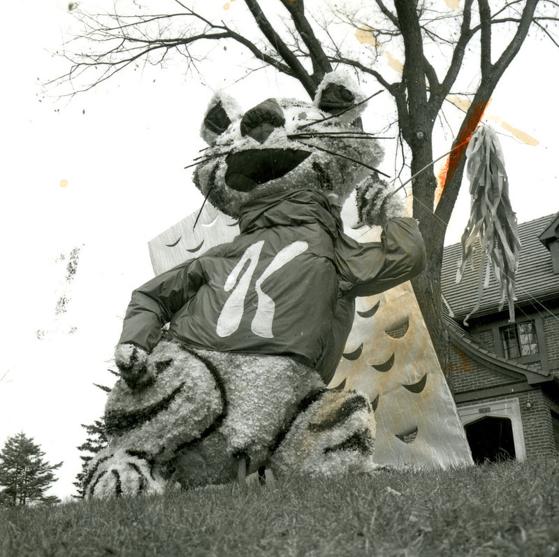 Gamma Phi Beta, Omega Chapter, homecoming lawn display features the Kansas State University Wildcat as Tony the Tiger, in front of a large cheese grater, October 1961.