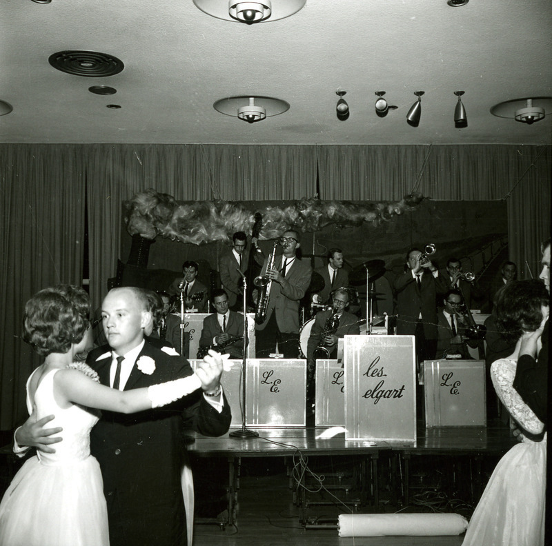 Couples dance to Les Elgart and his band at the Homecoming Dance, 1965.