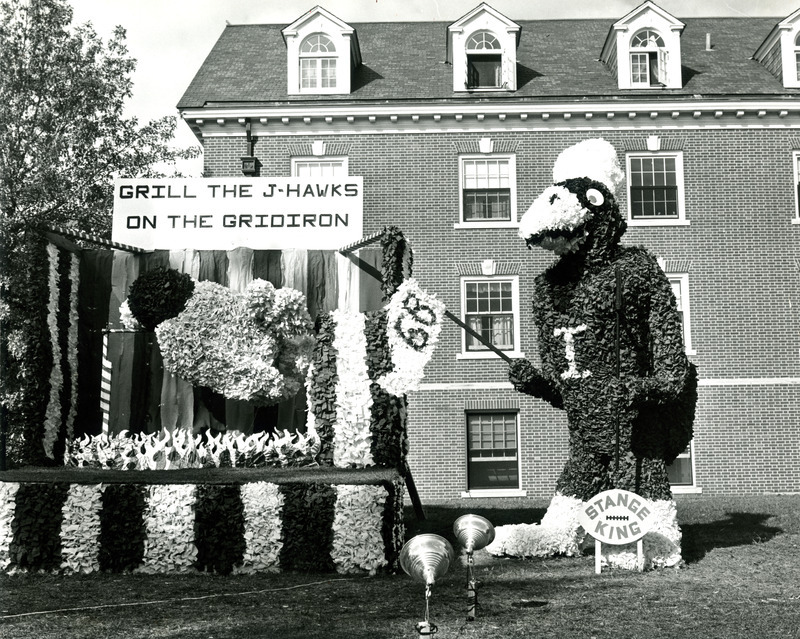 The Stange House and King House Homecoming lawn display, Grill the Jayhawks on the Gridiron, shows Cy roasting the Kansas University Jayhawk on a spit, 1968.