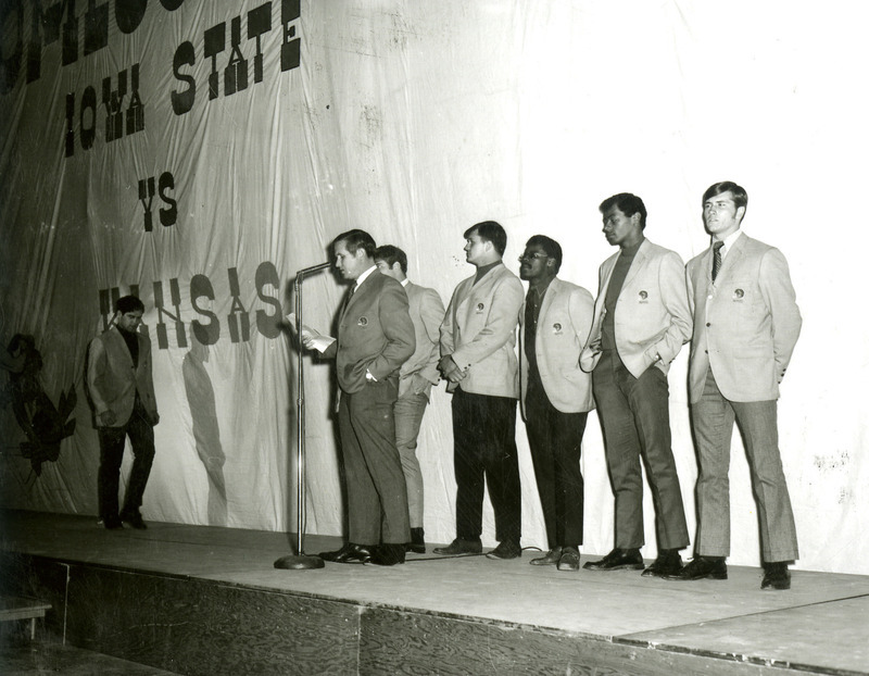 Coach Johnny Majors introduces the football team during a pep rally on the night before Homecoming, 1969.