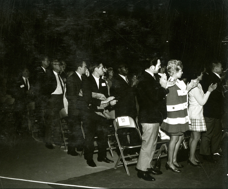 Alumni from the 1930s clap at the pep rally on the night before Homecoming, 1969.