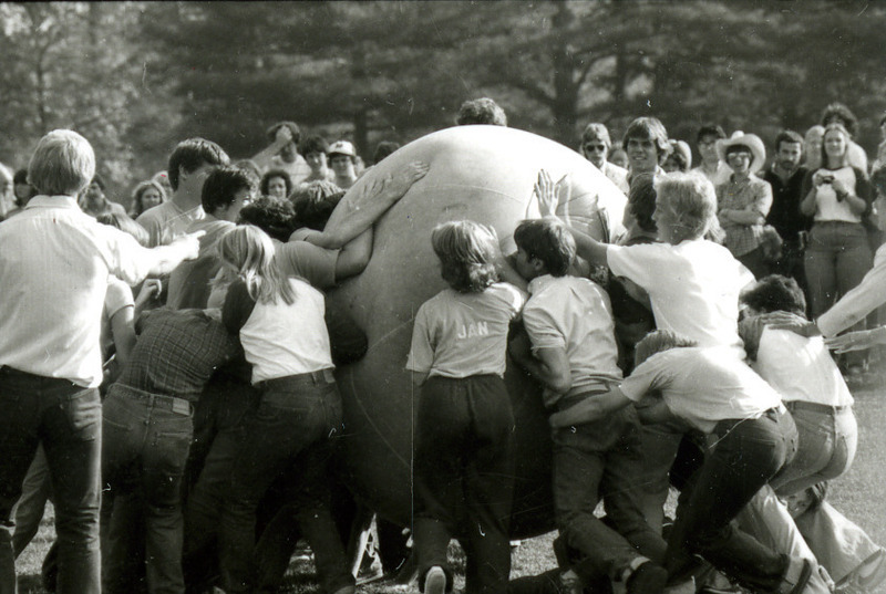 A crowd plays push-ball on Central Campus as part of Homecoming, 1978.