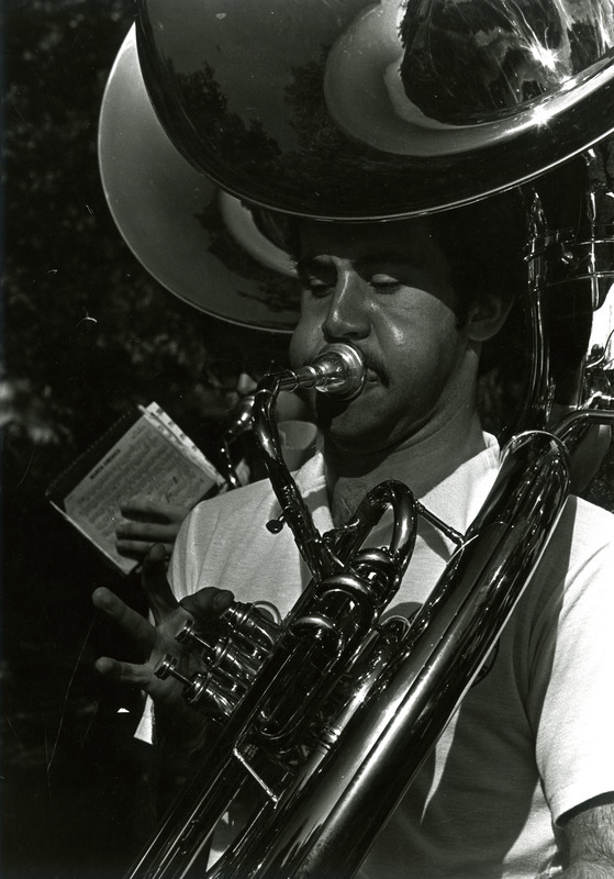 A tuba player performs with the ISU Marching Band for Homecoming, 1980.