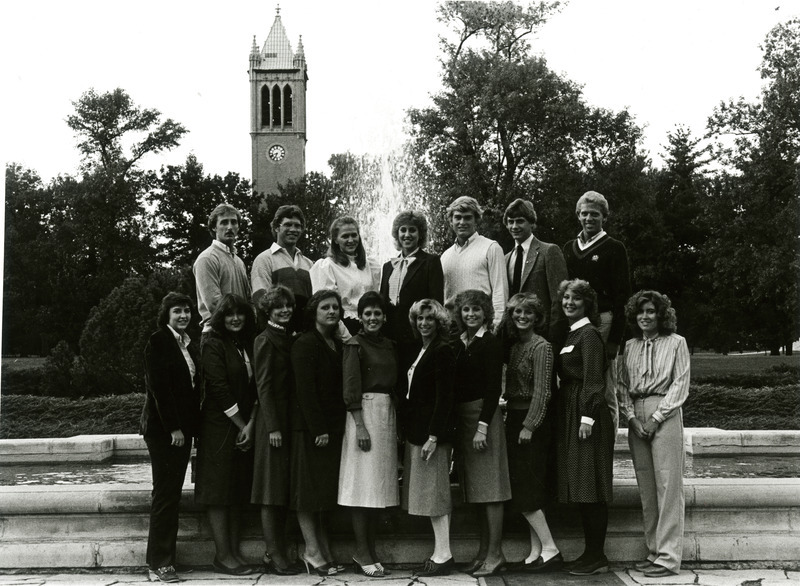 The Homecoming Central Committee poses by the Memorial Union fountain with the Campanile in the background, 1982.