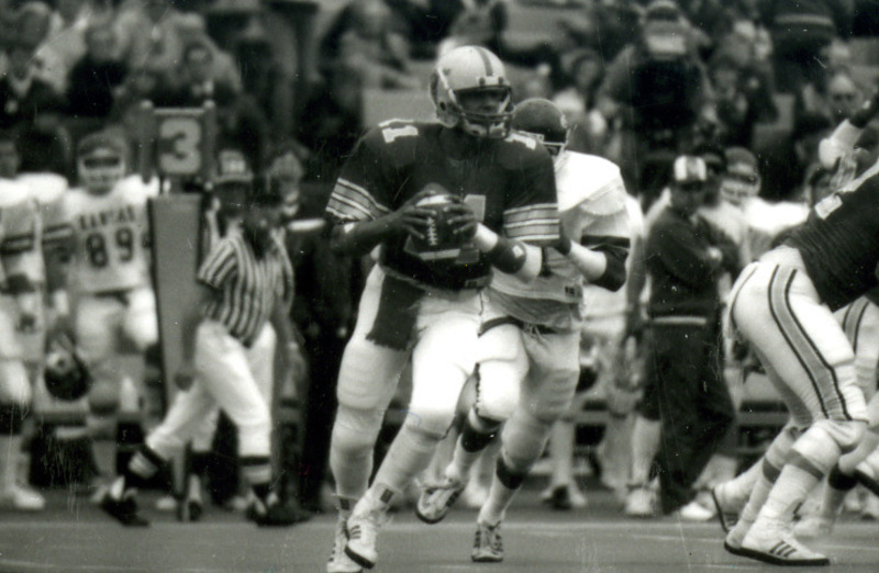 The ISU quarterback, Alex Espinoza, gets ready to pass during the Homecoming Game against Kansas, 1985.