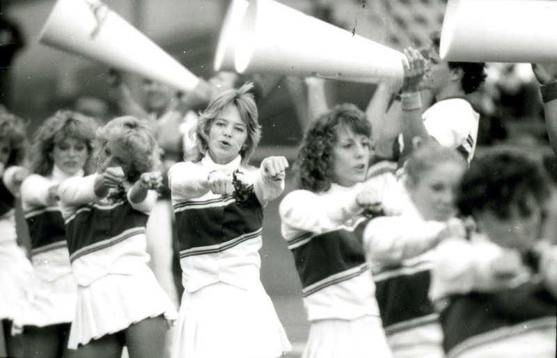 Cheerleaders perform at the Homecoming Game, 1985.