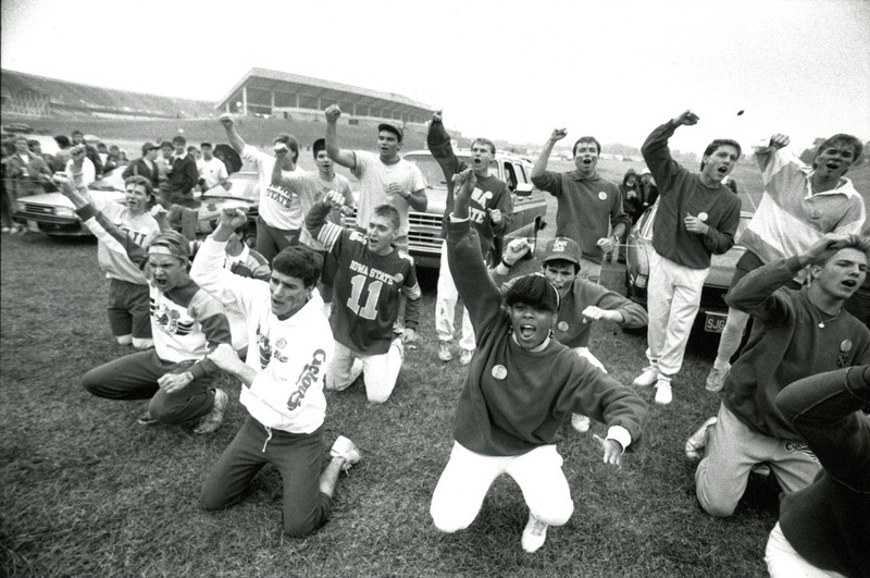 Alpha Kappa Lambda, Psi chapter, and Delta Sigma Pi, Beta Alpha chapter, perform the winning Yell-Like-Hell skit with the football stadium in the background, for Homecoming 1987.