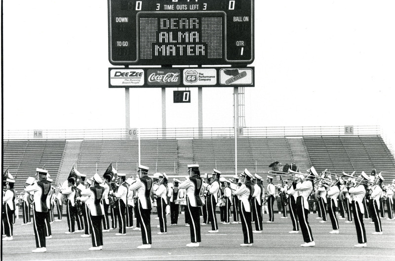 The ISU Marching Band practices under the scoreboard for Homecoming, 1987.