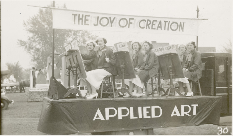 A 1937 VEISHEA parade float from the Department of Applied Art. "The Joy of Creation." Six women are seated in front of easels.