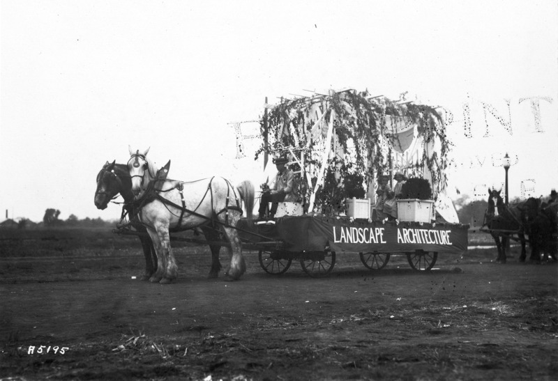 1923 horse-drawn float from the Department of Landscape Architecture. See photograph 1722-5-3 for alternate view of the same float. Potted plants and trellised plants create a garden for two girls to sit inside.