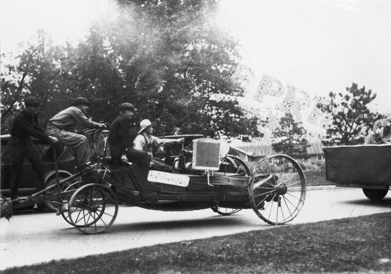 Four men in a motor vehicle.