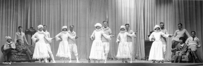 Five couples are dancing while two women and four men are in the background watching. An scene from the VEISHEA Nite Show, "Melody Magic." The Nite Show is the predecessor to Stars Over VEISHEA.