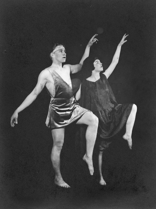 A man and woman in costume pose in a dance movement for a scene in the VEISHEA Nite Show, "Melody Magic." The Nite Show is the predecessor to Stars Over VEISHEA.