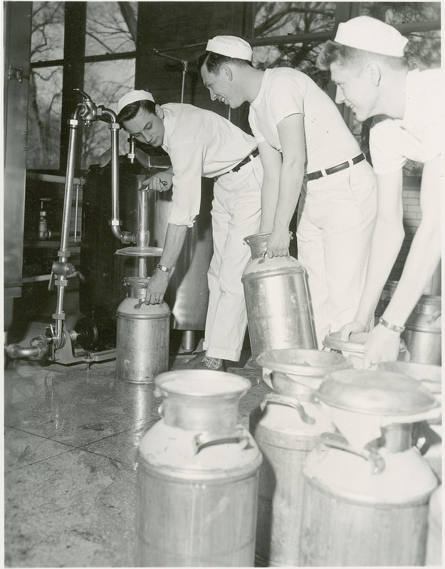 Three male students prepare ice cream for the Dairy Industry open house.