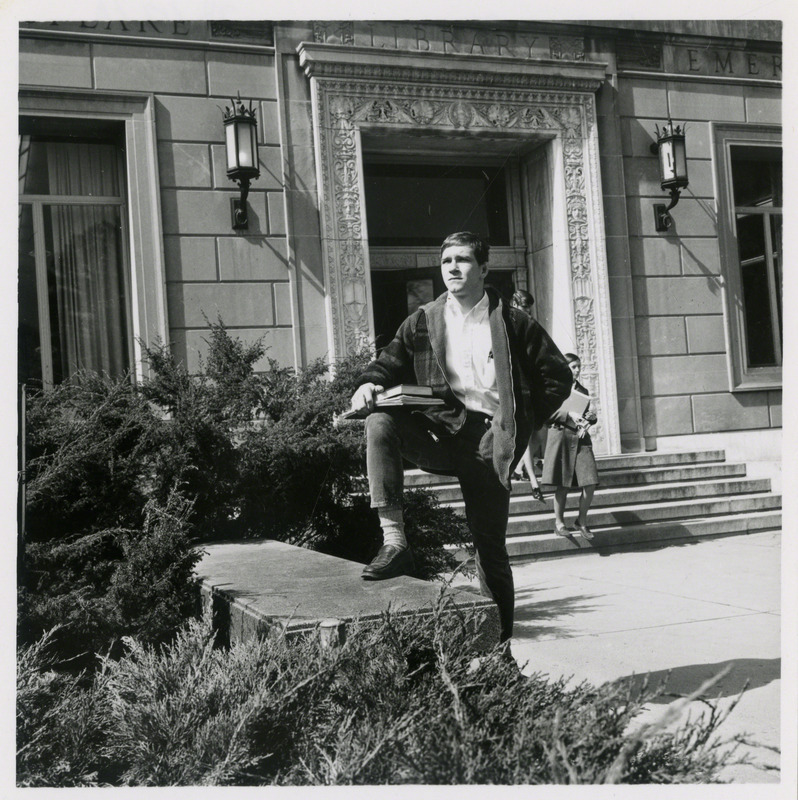 Dan Gable, Iowa State University wrestler, is posing in front of the east entrance to the Iowa State University Library, 1970.