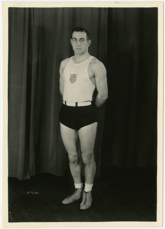 Robert Hess, Iowa State University wrestler, is standing for a portrait, June, 1932.