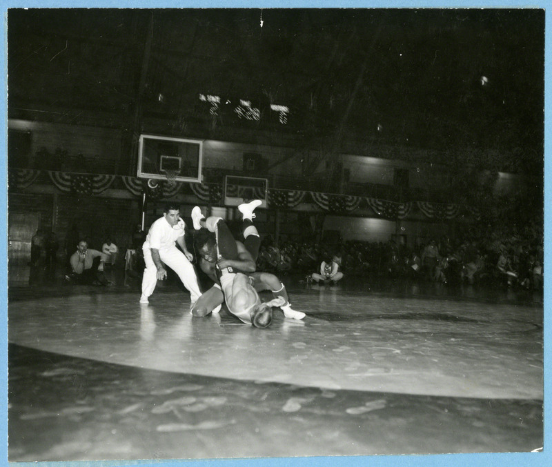 Ellie Watkins (top) grapples with Skip McCrarry (bottom).