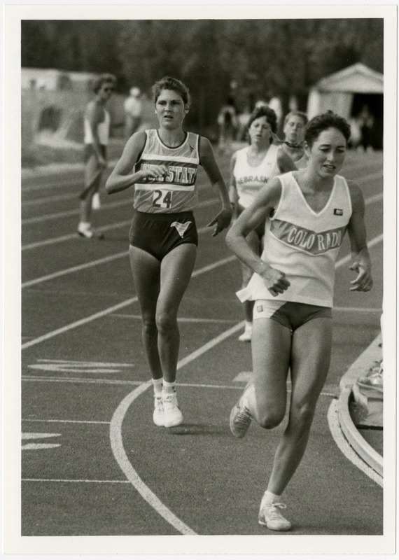 Several runners compete at a Women's' track competition, 1986. Runner on the left is from Iowa State University.