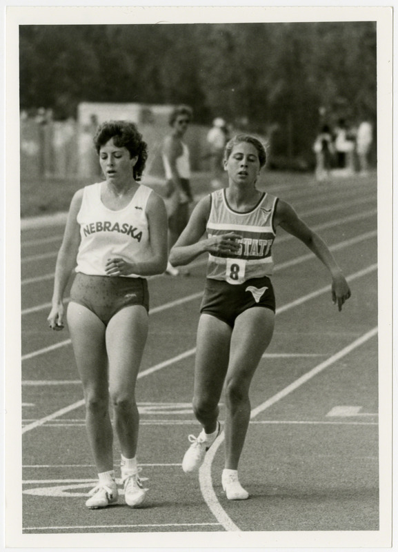 Two runners shortly after a race, 1986. The women on the right is from Iowa State University.