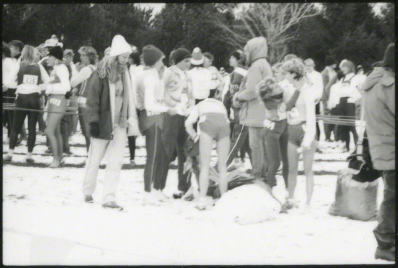 Runners gathering, either before or after the race, at the NCAA Women's cross-country meet Milwaukee, Wisconsin, on November 25, 1985, several hours before the plane crash. The main group in focus may be members of the Iowa State team.