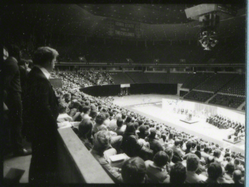 Wide shot of the inside of Hilton Coliseum, the audience, and the participants at the memorial service.