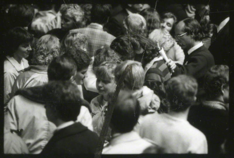 People are comforting each other at the conclusion of the memorial service, 1985.