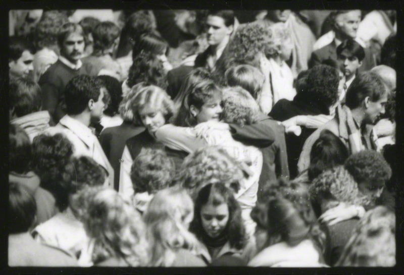 People are comforting each other at the conclusion of the memorial service, 1985.