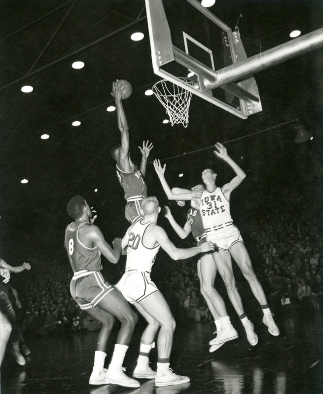 Five basketball players. Wilt Chamberlain (Kansas #13) is preparing to dunk the ball. Gary Thompson (ISU #20) is also visible.