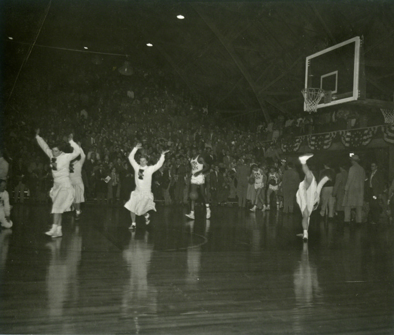 Iowa State cheerleaders take to the court.