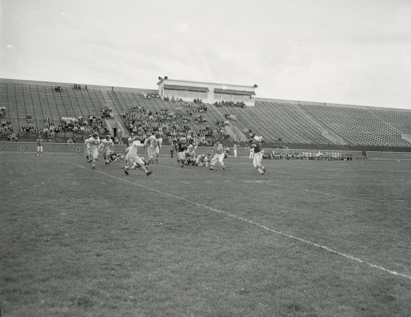 The freshman football game versus Nebraska being played before a small group of spectators.