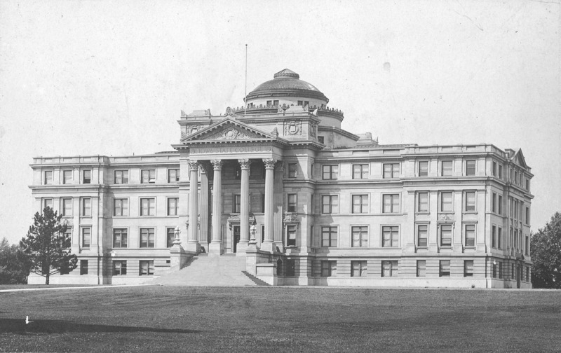 The front (west) of Beardshear Hall with a single tree in front.