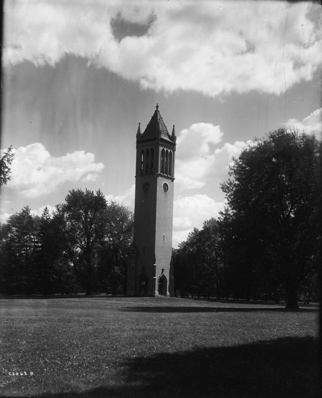 The north and west sides of the Campanile against a backdrop of dark trees and clouds at 2:23 pm.