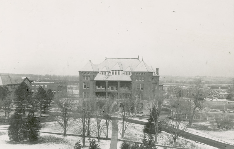 This winter scene depicts Catt Hall with the surrounding trees in the foreground. MacKay and Margaret Halls can also be seen.