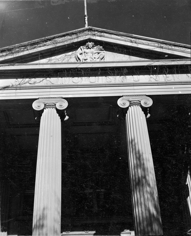 Ceres, the goddess of agriculture, appears in the Curtiss Hall portico pediment, above the word Agriculture in the frieze below, supported by two central columns.