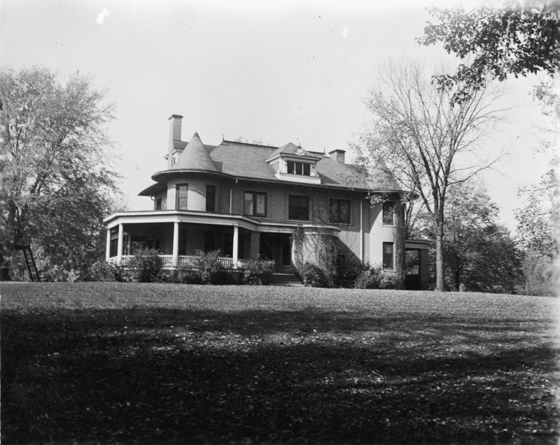 A large expanse of lawn is in the foreground, while the east side of the Knoll occupies the center of this 1918 photograph.