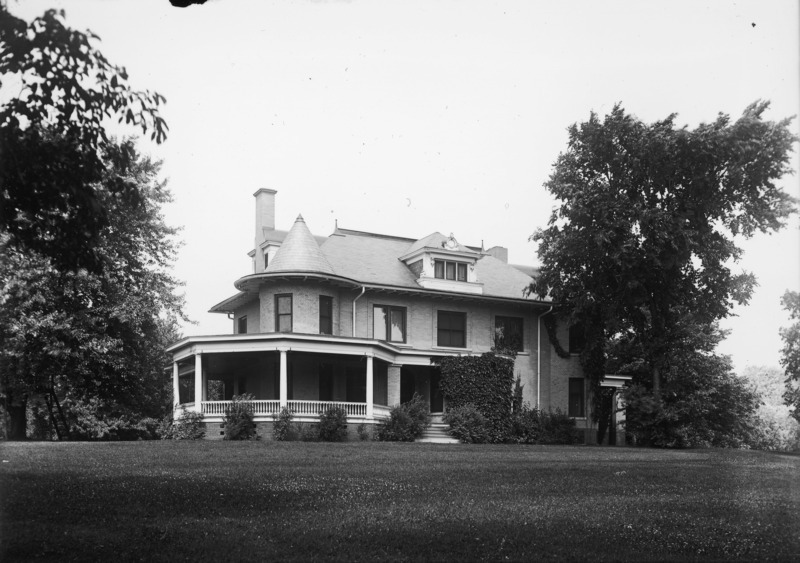 The eastern side of the Knoll is flanked by trees on either side and the lawn in the foreground.