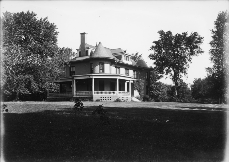 Long shadows stretch across the front lawn of the Knoll in this view of the southeast corner of the house.