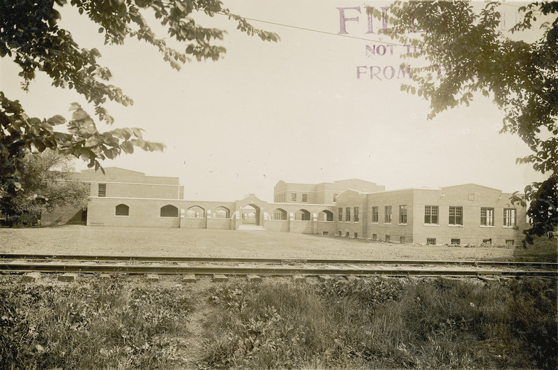 The Ames and College Railroad tracks are visible in this view of the south entrance to the Quadrangle (later known as Lagomarcino Hall), 1912.