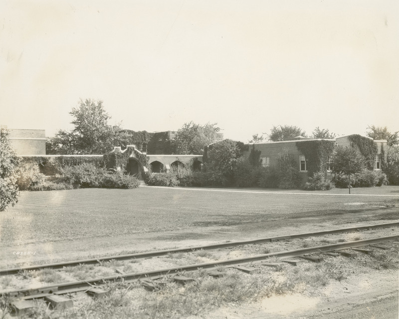 The Ames and College Railroad tracks are visible in this view of the south entrance to the Quadrangle (later known as Lagomarcino Hall), 1929.