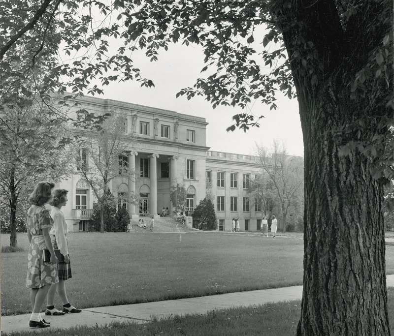 MacKay Hall, 1948 or 1949. Two women can be seen walking by in the foreground.