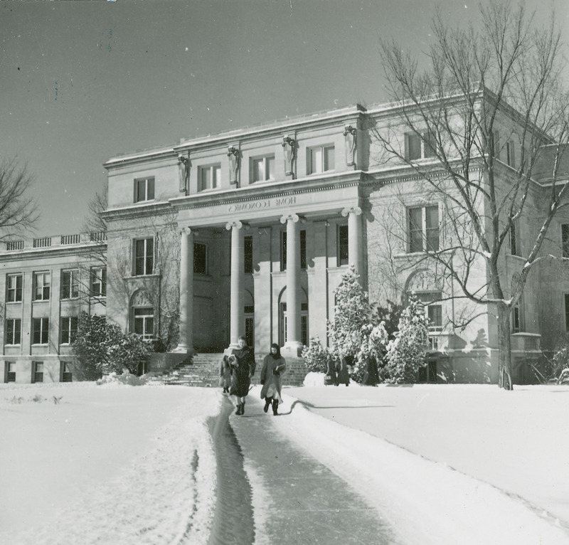 MacKay Hall in 1953. Surrounding area is covered in snow. Several women are seen walking away from the building.