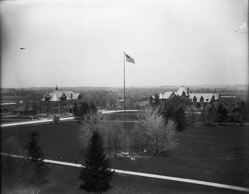 In this aerial view Morrill Hall is on the left and Margaret Hall is on the right. The Hub can be seen to the left (west) of Morrill Hall. The American flag is flying in the center of the photograph.