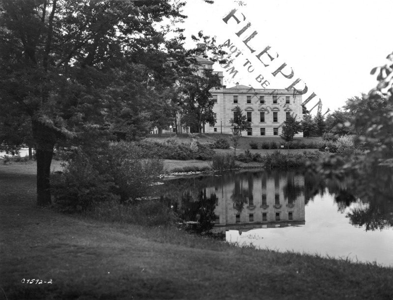 The east facade of the Memorial Union is reflected in Lake LaVerne.