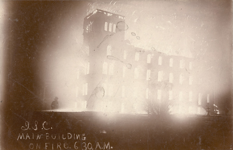 Old Main on fire at 6:30 am on the December day in 1900 that the first fire occurred. The building appears to be completely engulfed in flames, although it is only the North Wing that was damaged.