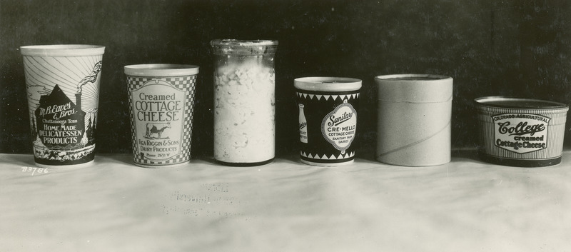 A variety of cottage cheese products made by companies or colleges other than Iowa State College (University) are shown in this photograph taken on July 16, 1930.