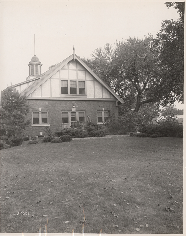 Photograph showing a person standing outside the entrance to Landscape Architecture.