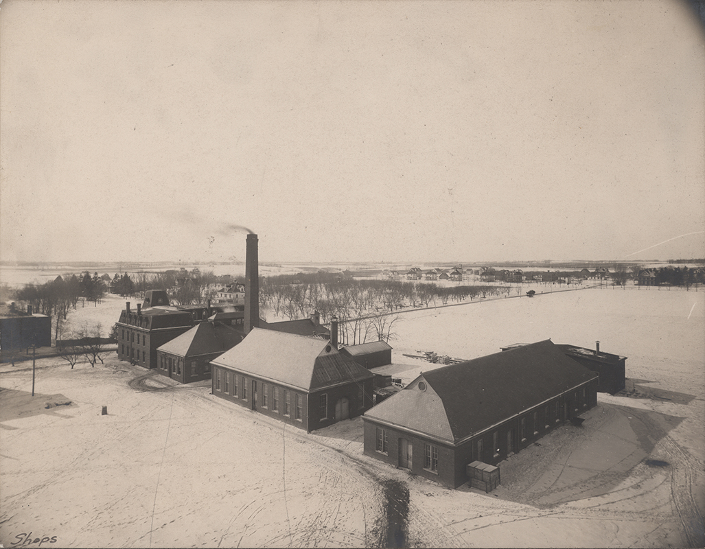 Photograph of the engineering laboratories. From left to right (south to north) these buildings are the Laboratory of Mechanics, the Power Station, Building A, and the Aerospace Laboratory. The West Boarding Cottage can also be seen on the far left (southeast).